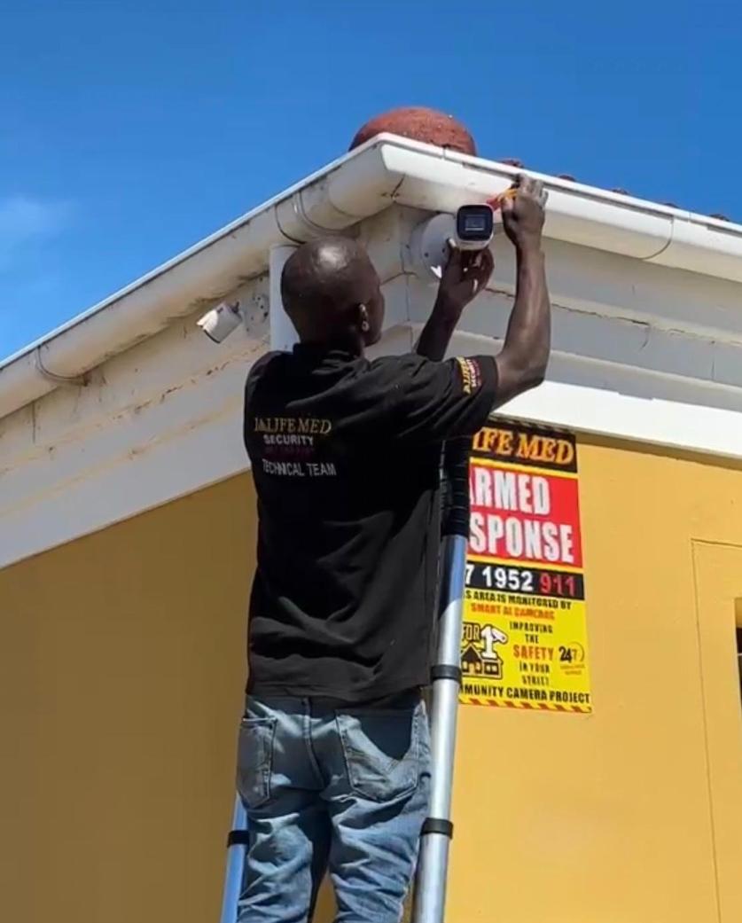 Life Med technician installing a CCTV camera